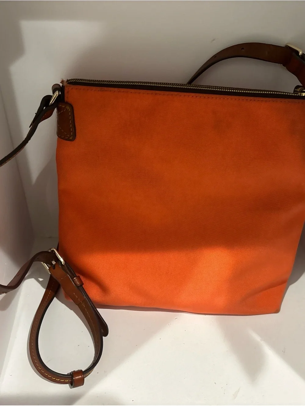 Dooney & Bourke Bright Orange Crossbody with Brown Leather Strap